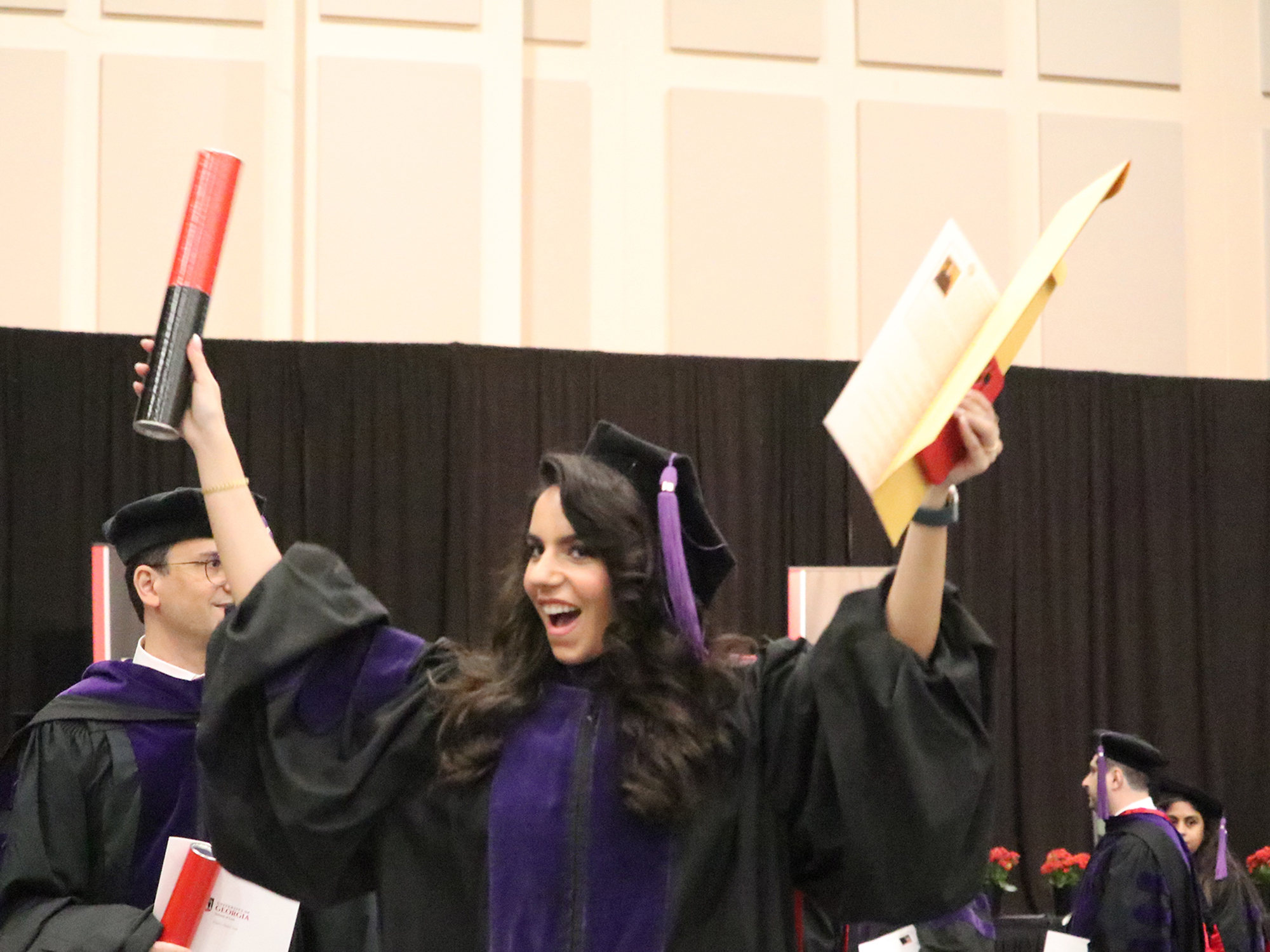 Mona Abboud celebrates with her new diploma.