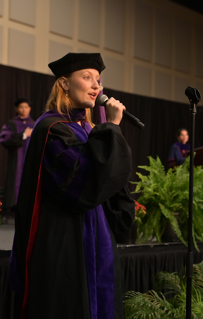 Lauren Harter sings “The Star-Spangled Banner” at the beginning of the ceremony. Photo by Dennis McDaniel.