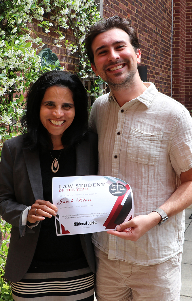 Third-year student Jacob Blott (right) and Dean Usha R. Rodrigues celebrate his selection as a Law Student of the Year by National Jurist. He was one of five students nationwide to receive this honor, due in large part to his consistent efforts to improve the law school experience for his fellow students. Blott served as the Student Bar Association president for 2024–25.