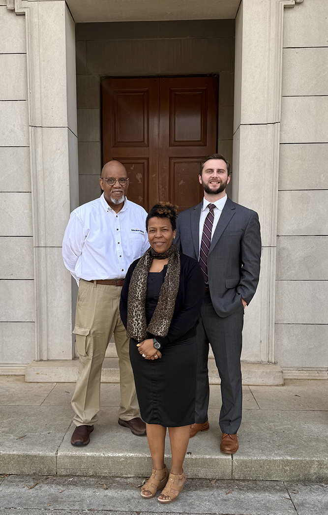 Third-year student Caleb Morris (right) and Associate Dean Andrea Dennis (center) worked with Richard Dunn of the local nonprofit Education Matters to establish the Classic City Civics Project with a $3,000 grant from the Foundation of the Federal Bar Association. This collaborative initiative is designed to provide local schools with resources to engage students in understanding the law, government and citizenship.